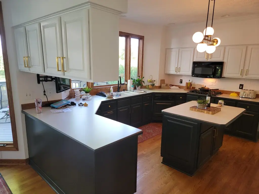 Kitchen with refinished dark cabinets