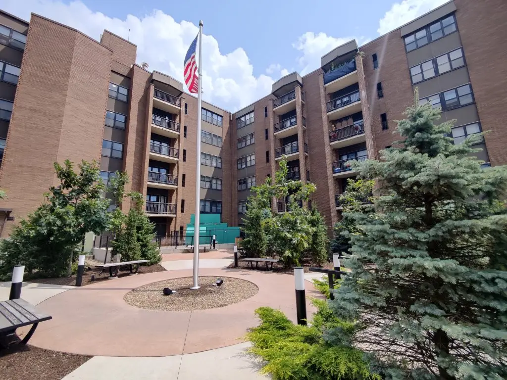 Painted commercial apartment building exterior and courtyard